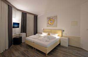 Ένα ή περισσότερα κρεβάτια σε δωμάτιο στο Hotel Scheffelhof