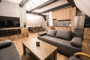 a living room with a couch and a table at Agroturystyka u Wańka in Wisła