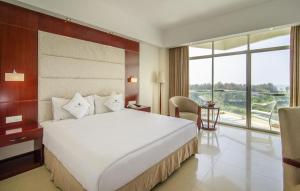 Postel nebo postele na pokoji v ubytování Ocean Paradise Hotel & Resort
