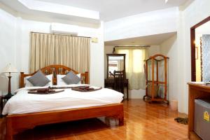 Ένα ή περισσότερα κρεβάτια σε δωμάτιο στο Avare House Krabi