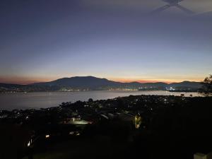 a view of a city and a body of water at Hillside Hideaway Sleeps 10 Stunning Views in Howrah