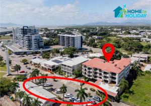 an aerial view of a building with a red circle around it at Waterfront Studio Room Near City Stadium & Ferry in Townsville in Townsville