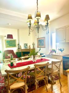 a dining room with a table and chairs at Forest cottage top of the world in Vourgareli +47 photos