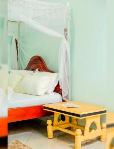 Ένα ή περισσότερα κρεβάτια σε δωμάτιο στο Hotel Thimba Land