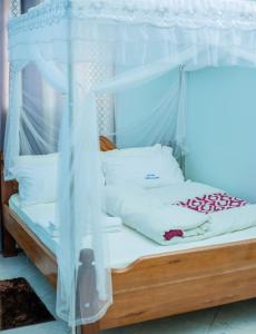 Ένα ή περισσότερα κρεβάτια σε δωμάτιο στο Hotel Thimba Land