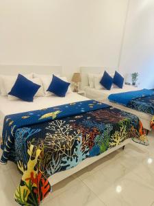 Ένα ή περισσότερα κρεβάτια σε δωμάτιο στο The TJ Lanka