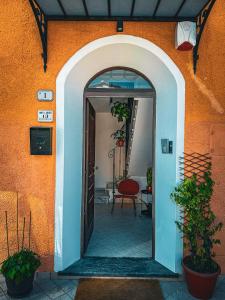 an entrance to a building with an open door at Casa Montebello in Camaiore