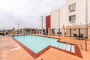 a large swimming pool in a building at Motel 6-Laredo, TX - Airport in Laredo