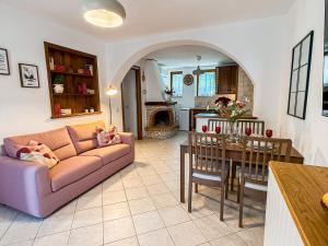 a living room with a couch and a table at Casa Montebello in Camaiore