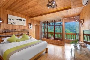 Postel nebo postele na pokoji v ubytování Longji Terrace La vie Inn