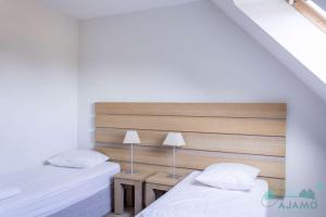 Postel nebo postele na pokoji v ubytování 110 - Appartement duplex 6 personnes vue sur Golf.