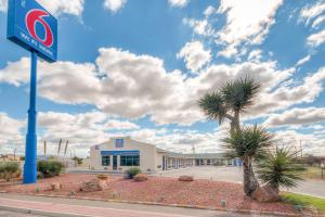 a mobil gas station with a palm tree in front of it at Motel 6-Van Horn, TX in Van Horn