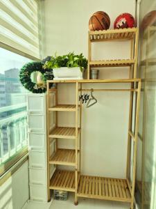 a closet with shelves and a basketball on it at Healing Gangchu in Anyang +4 photos