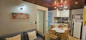 a kitchen and dining room with a table and chairs at BinsHeim HBC - Seoul's Aesthetic Stay with the best Night view Rooftop in Seoul