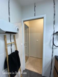 a door leading into a room with a projector at L'Instant Loire in Saumur