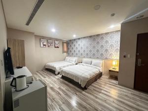 Ένα ή περισσότερα κρεβάτια σε δωμάτιο στο 星月文旅民宿 +41 φωτογραφίες