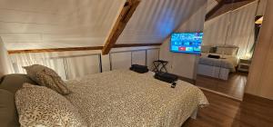 Μια τηλεόραση ή/και κέντρο ψυχαγωγίας στο Villâris Chambres d'hôte