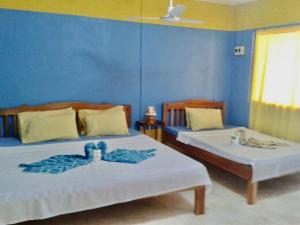 Postel nebo postele na pokoji v ubytování Sunny Shine Beach Resort