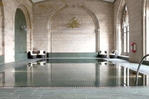 a swimming pool in a building with a pool at Raven Wing 17 - Aonach Mor in Fort Augustus