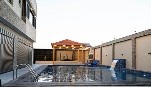 a swimming pool in the middle of a building at Sky Villa in Amman