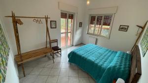 Postel nebo postele na pokoji v ubytování Etnea99 la tua casa tra Etna e il mare