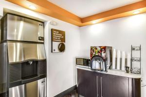 a kitchen with a refrigerator and a coffee maker at Motel 6-Carson, CA in Carson