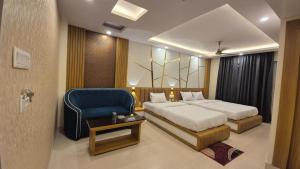 Voodi või voodid majutusasutuse HOTEL SEA SOUL-A UNIT OF AYAN GROUP HOTEL and RESORT toas