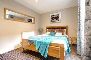 Postel nebo postele na pokoji v ubytování Chester Apartments