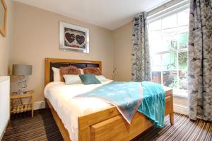 Postel nebo postele na pokoji v ubytování Chester Apartments