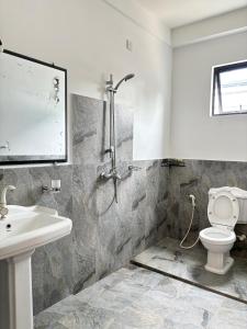 Ένα μπάνιο στο Coloration Villa Hikkaduwa