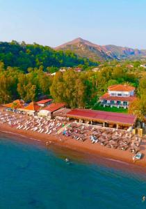 an aerial view of a resort on the beach at Thanos Hotel in Muğla