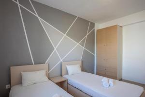 Postel nebo postele na pokoji v ubytování Serenity Garden House + 2 fotografie