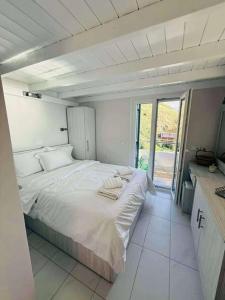 Ένα ή περισσότερα κρεβάτια σε δωμάτιο στο Aegean View Apartment