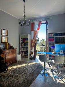 a living room with a table and chairs and a window at See The Sea B&B in Salerno