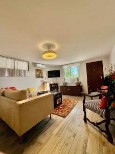 a living room with a couch and a chair at Palm Beach Apartment in La Duquesa in Manilva