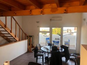 a person sitting at a table in a room at Bajada 1 in Las Grutas +8 photos