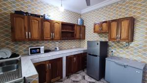 Η κουζίνα ή μικρή κουζίνα στο The Petrance Apartment