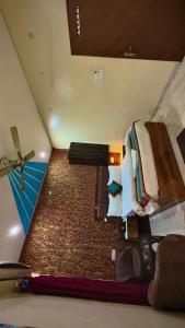 an overhead view of a bedroom with a bed and a ceiling at Classy5 Guest House in Varanasi