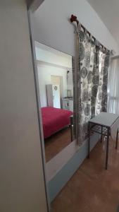 En eller flere senge i et værelse på Minimonoambiente Planta Baja