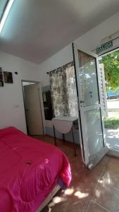 En eller flere senge i et værelse på Minimonoambiente Planta Baja