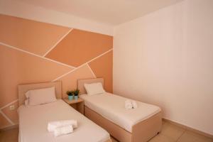 Postel nebo postele na pokoji v ubytování Serenity Garden house 2