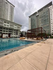 a swimming pool in a city with tall buildings at Solinea Residences 30thfloor Tower4 Ayala Business Center Cebu ph in Cebu City