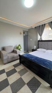 Ένα ή περισσότερα κρεβάτια σε δωμάτιο στο Kampala BnB +9 φωτογραφίες