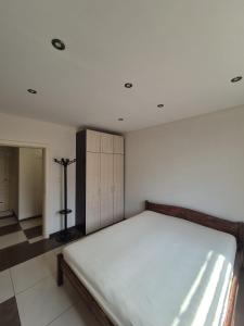 a bedroom with a bed in a room at Апартамент Top Central in Yambol +2 photos