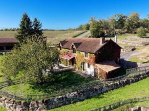 an aerial view of a house in a field at Lac privé, forêt, calme absolu dans un gîte tout confort in Saint-Estèphe