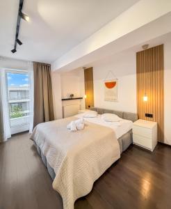 Postel nebo postele na pokoji v ubytování Airport Residence - Apartment Across From Otopeni Airport - Bucharest