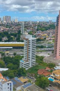 an overhead view of a city with tall buildings at Bahia Flats Facility View in Salvador