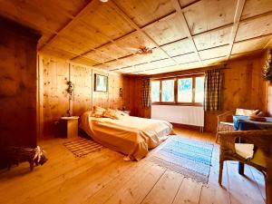a bedroom with a bed in a wooden room at Haus Freistabl - Uriges Bauernhaus für 6 Personen mit Sauna & Bergblick im Ötztal in Sölden +23 photos