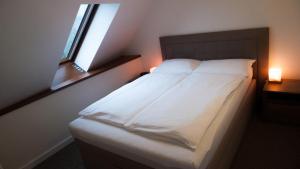 Postel nebo postele na pokoji v ubytování A7 Apartments