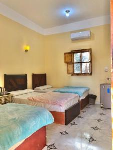 Postel nebo postele na pokoji v ubytování Arkan siwa أركان سيوة